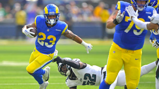 Oct 8, 2023; Inglewood, California, USA; Los Angeles Rams running back Kyren Williams (23) carries the ball past Philadelphia Eagles linebacker Zach Cunningham (52) in the first half at SoFi Stadium. Mandatory Credit: Jayne Kamin-Oncea-USA TODAY Sports